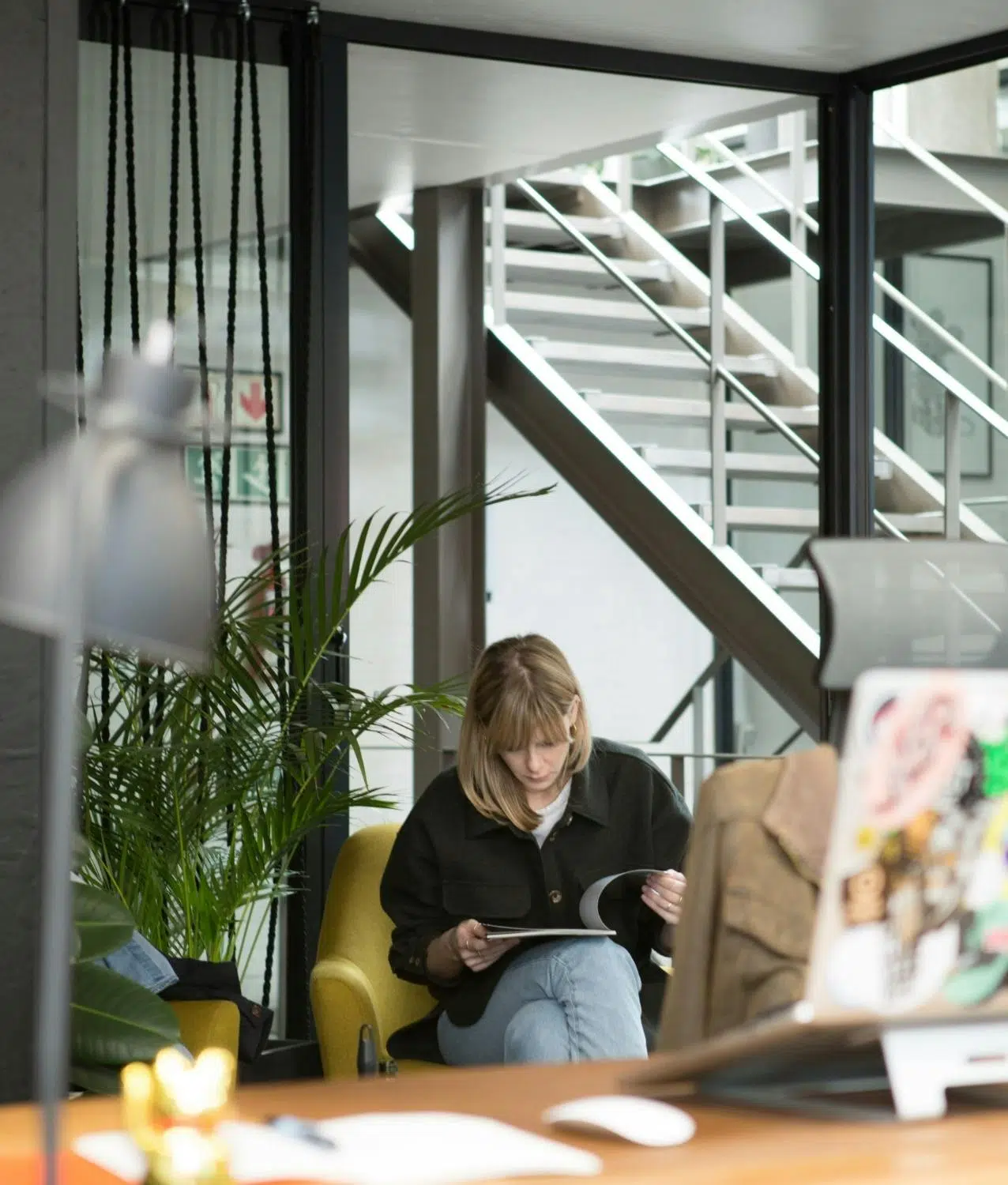 Chev reading a book in a nook